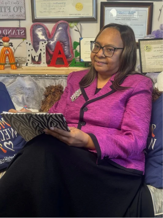 Dr. Marcia Morrison seated in her office